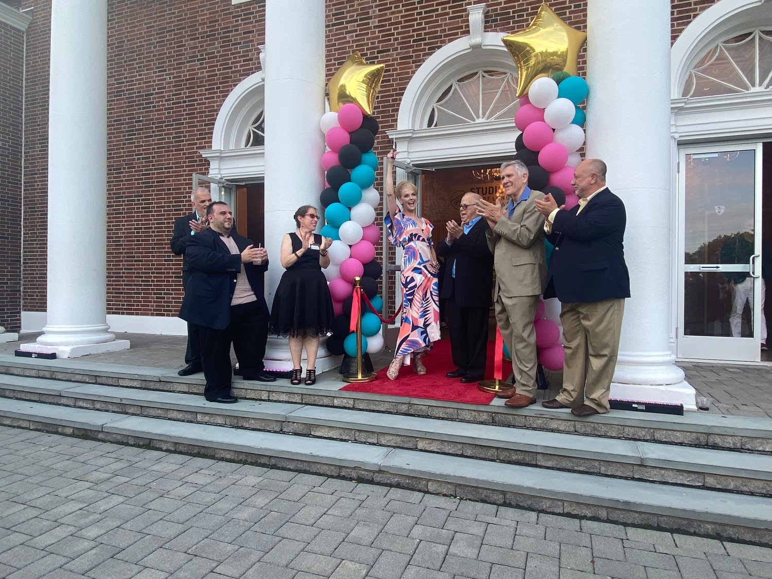 From left to right: Executive artistic director David Dubin, executive director Chris Rosselli, director of educational theatre Tiana Christoforidis, actress Angie Schworer, executive artistic director Rick Grossman, executive project manager Rick Hachemeister and managing director Michael Blangiforti cut the grand-opening ribbon.