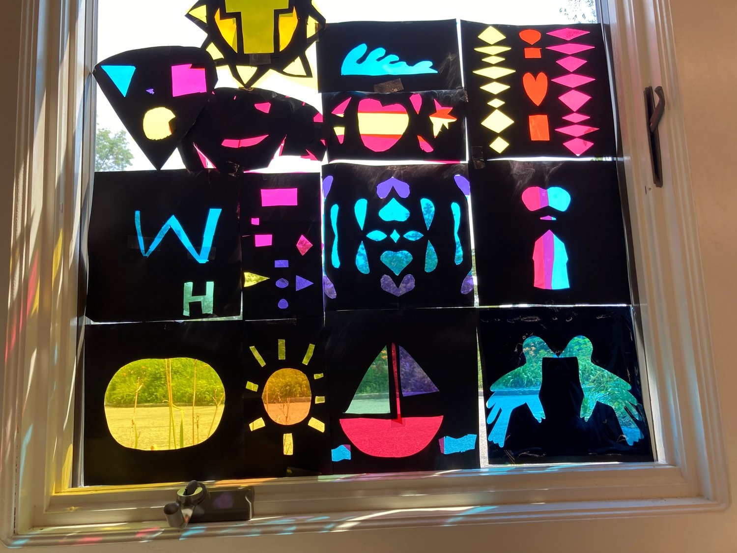 Stained-glass art that students created during Camp Color.